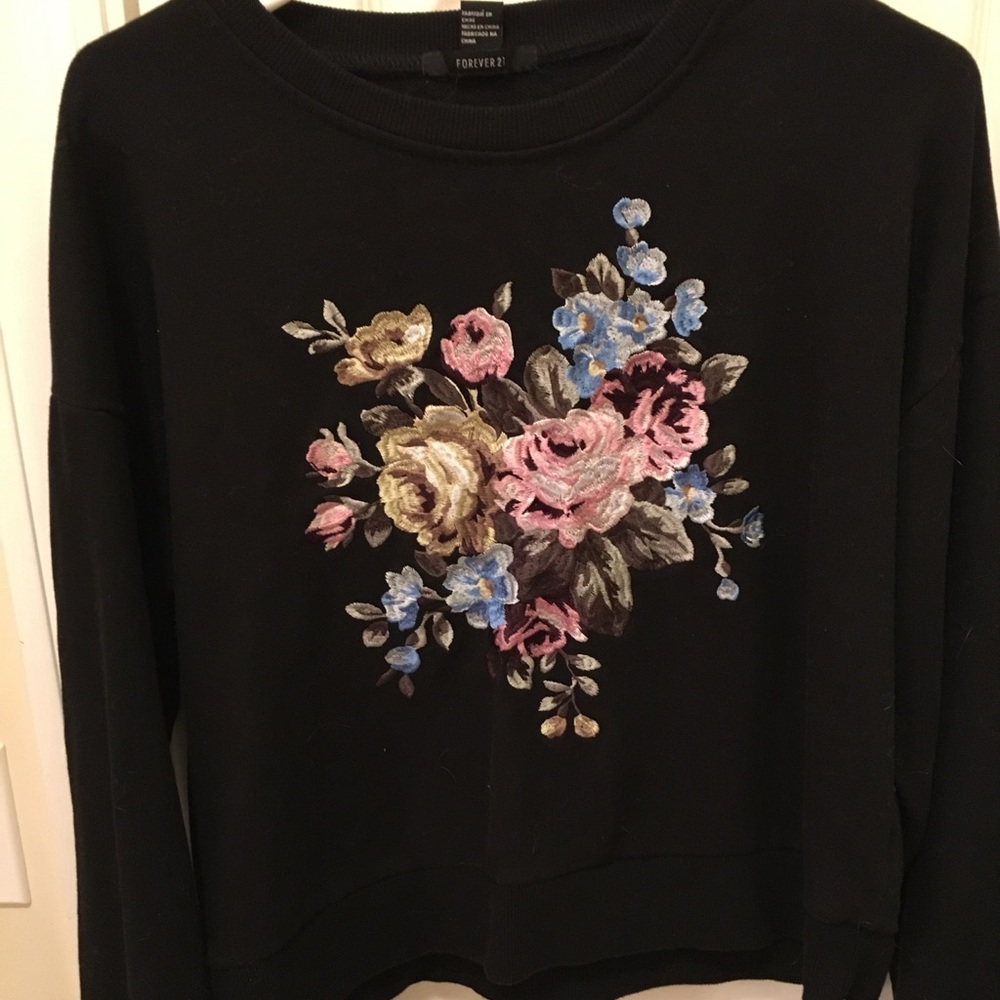 Black sweatshirt with flower appliqué